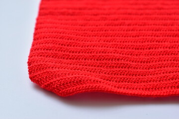 red wool knitted yarn texture, woolen fabric on white background