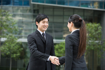 Happy Business people shaking hands.