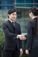 Happy Business people shaking hands.