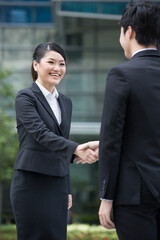 Happy Business people shaking hands.