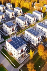 Fototapeta premium Eco-friendly apartment buildings with large solar panels on roofs surrounded by bright autumn trees