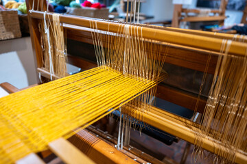 close-up high resolution shot of a spinning loom. handloom Textile production and products....