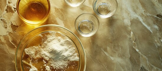 Chemical ingredients for Cosmetics and Toiletries product, viewed from above: Sulfur, Liquid Poly Aluminium chloride, Microcrystalline wax, and Alcohol in a Petri dish.
