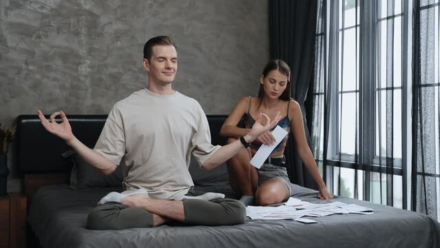 Young man doing mindfulness and peacefulness meditation ignoring problem while his wife or lover yelling with frustrated and upset expression. Marriage problem ignorant lifestyle. Adit