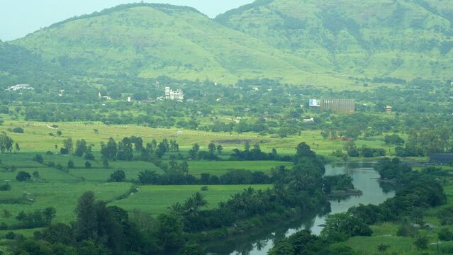 Tilt-up Reveal Of Lush Green Mountains In Mist In Lonavala, Pune District, Maharashtra, India. wide shot