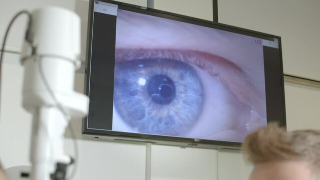 The eye exam room looks like a screen on the wall in the eye doctor's office. ophthalmologist visit.