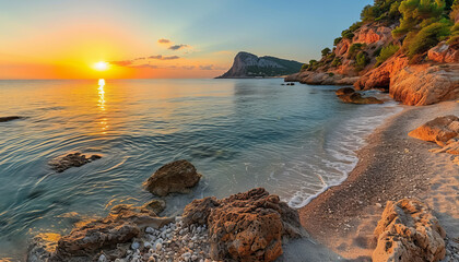 A dramatic sunset over a beautiful seaside with cliffs and a Mediterranean feel at Ca Llentrica...