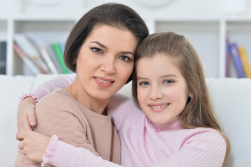Close-up portrait of a charming girl with mom