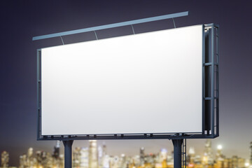 Blank white horizontal billboard on cityscape background at night, perspective view. Mockup, advertising concept