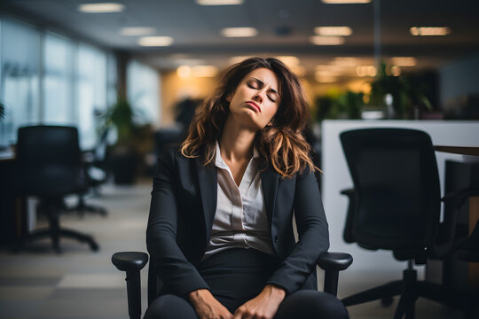 Businesswoman sitting sleep dozing and working hard at with front of computer and lots of documents on the table in workplace at late with serious action, Work hard and too late concept