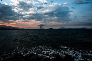 Fire in distances, over the sea. 