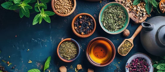 Foto op Plexiglas Herbal tea and ingredients seen from above on table. © AkuAku