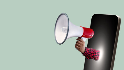 A human hand holding a megaphone comes out from the mobile phone screen