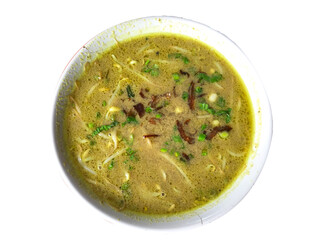 Soto ayam is a typical Indonesian food in the form of a kind of chicken soup with a yellowish sauce. Isolated on white background