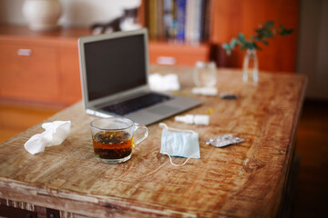 Obraz na płótnie Canvas Medications on table near laptop