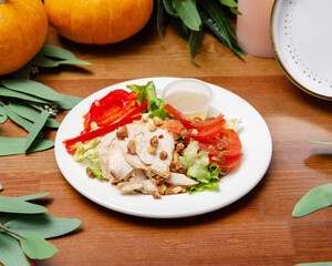 Salad with grilled turkey, tomato and lettuce