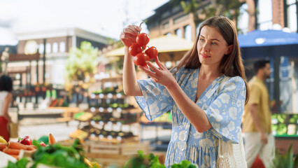 Woman Shopping for Fresh Vegetables from a Local Farm Market Stall. Young Beautiful Female Choosing Red Bell Peppers and Tomatoes from a Selection with Organic Chemical-Free Produce  - Powered by Adobe