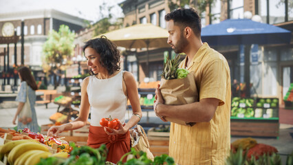 Beautiful Multiethnic Couple Shopping for Fresh Seasonal Fruits and Vegetables for a Delicious...