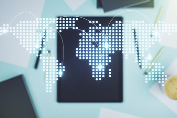 Abstract creative world map with connections and modern digital tablet on background, top view, international trading concept. Multiexposure