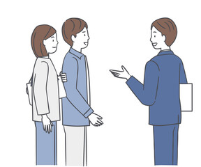 若い夫婦に案内をするビジネスマン