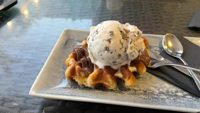 waffle with milk chocolate and stracciatella ice cream freshly prepared and ready to eat