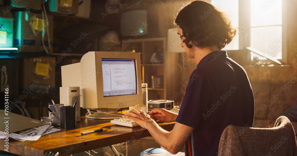 Poster Caucasian Male Software Engineer Programming on Old Desktop Computer In Retro Garage. Focused Man Starting Fintech Startup Company In Nineties. Coding Innovative Online Service At Home.