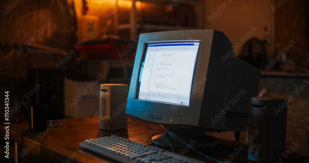 Leinwandbilder close up shot of old desktop computer on work desk of software developer in retro garage. dated pc h