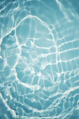 Bluewater waves on the surface ripples blurred. Defocus blurred transparent blue colored clear calm water surface texture with splash and bubbles. Water waves with shining pattern texture background.