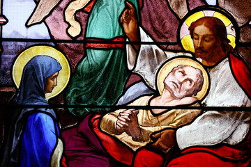 Saint Aubin church.  Stained glass.  The Death of Saint Joseph, with Mother Mary and Jesus....