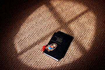 Obraz premium Holy Bible with medallion representing Jesus..