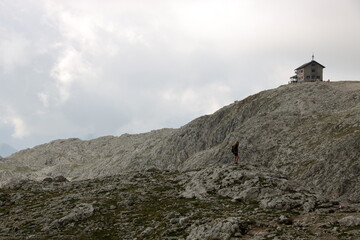 Fototapeta na wymiar girl admiring the landscape of Dolomite's mountains