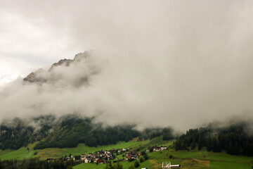 Misty and cloudy alpine landscape in Alta Badia
