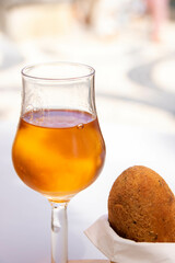 codfish fried ball and a glass of Porto wine