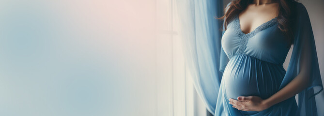 Young beautiful sexy and stylish pregnant woman on blue background. Banner horizontal. - obrazy, fototapety, plakaty