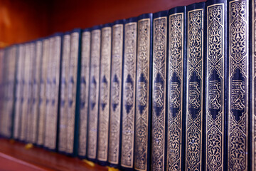 Row of Holy Quran ( Kuran ) books in a mosque. Islamic symbol. Phnom Penh. Cambodia.