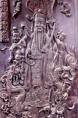 Emperor Jade Pagoda (Chua Ngoc Hoang or Phuoc Hai Tu). Taoist temple.  Carved wooden panel. Ho Chi Minh city. Vietnam.