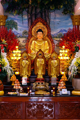 Thien Quang Co Tu buddhist temple. Main altar with statues of Buddha. Ho Chi Minh city. Vietnam.