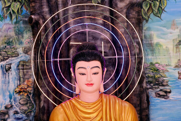 Phuoc Hue buddhist pagoda.  Shakyamuni Buddha sitting in the meditation pose under the Bodhi tree....
