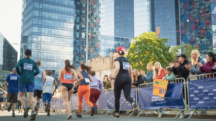 Back View: Diverse Group of Marathon Joggers Competing for the First Place, Running in a City Trail...