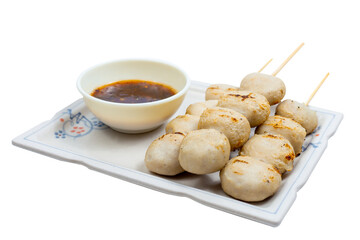 Toasted meatballs with spicy sauce.