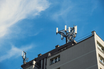 5G radio transmitter residential Building Rooftop Cell Tower. Cell phone communication antenna New...