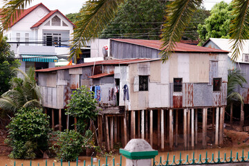 Poor houses on stilts. Mekong Delta.