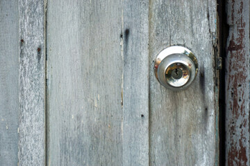 closeup of a vintage door knob on an old white door