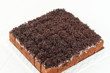 Sliced Chocolate Sponge Cake with Shredded Chocolate Toppin