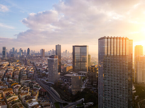 Istanbul's glass and concrete skyscrapers, home to offices, hotels, and residential complexes at sunny morning. Aerial drone view
