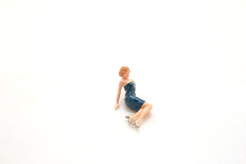 Tiny figurine of lady in elegant attire isolated