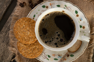 Top view of black coffee in porcelain cup