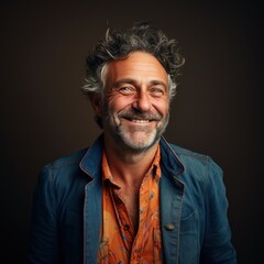 Obraz premium Smiling middle aged mature man posing, joyful smile, wearing casual clothes