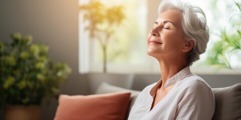 An Elderly Woman Meditates At home