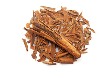 Top view of Dry organic Cinnamon sticks (Cinnamomum verum) isolated on a white background.